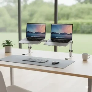 Dual laptop stand freeing up desk space by holding two computers above the desktop, creating a tidy and organized workspace.