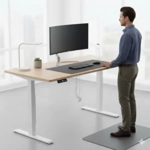 An ergonomic, electric adjustable-height medium size desk raised to the standing position for health and comfort.